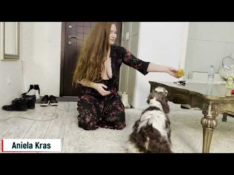 Aniela plays with her dog