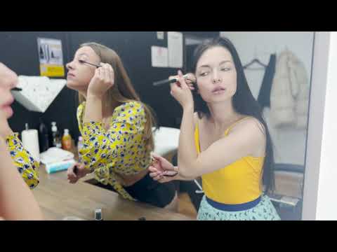 Polina apply makeup on face