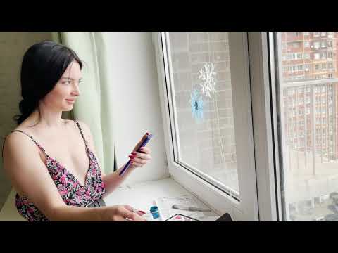 Polina draws on glass